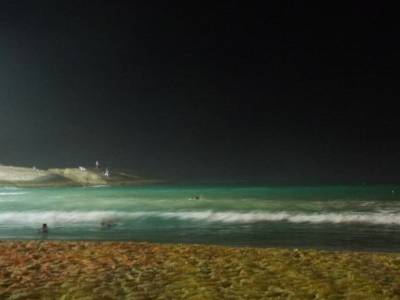 Arpador, surfing by night