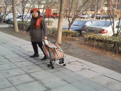 Xiang Qun part au marché